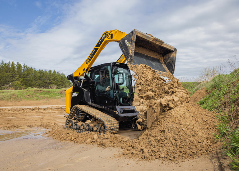 ASV VT-80 Compact Track Loader dumping dirt