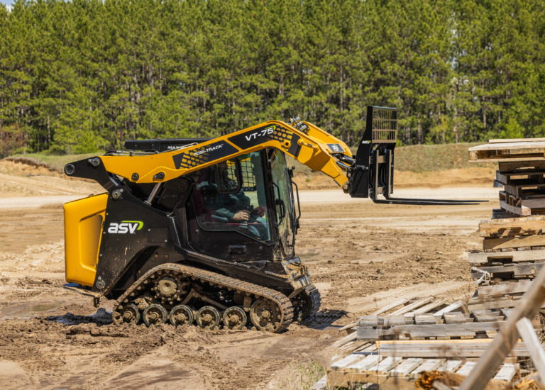 ASV VT-75 Compact Track Loader loading pallets.