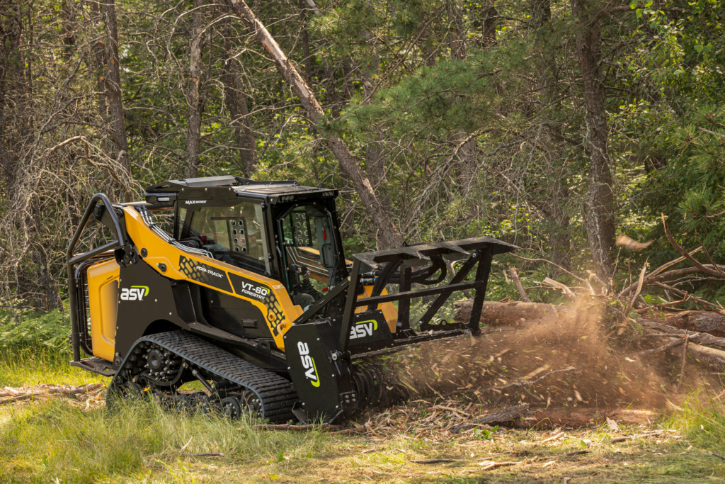 An ASV VT-80 Forestry mulches brush with an ASV mulcher attachment